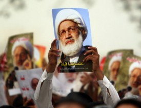 Shroud-clad Bahrainis rally ahead of cleric’s trial